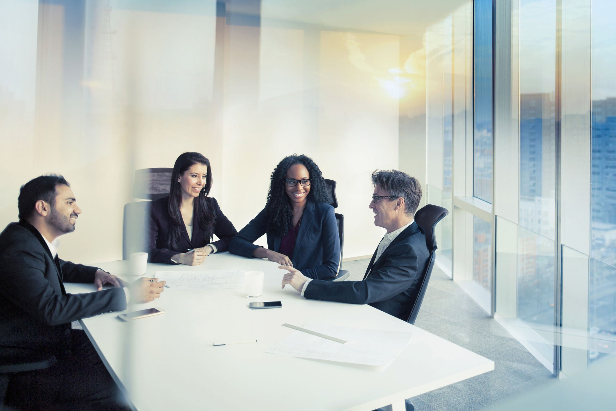 Business colleagues talking in meeting room 